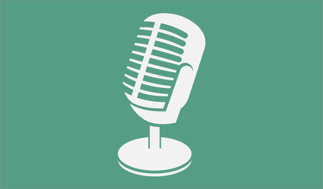 White microphone on green background